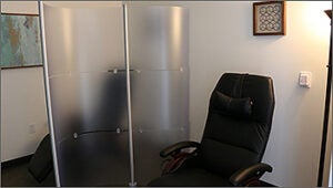 Comfortable black chair in relaxing office space. 