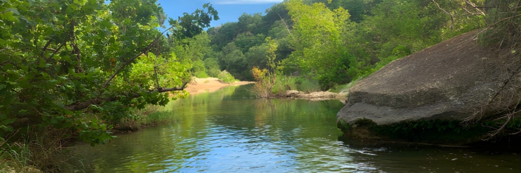A view of the stream on the lush trail of the Barton Creek Greenbelt, Austin, TX