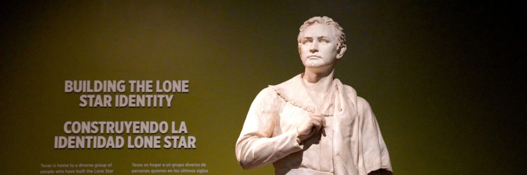 Marble statue of a man on an olive-green background with text on the left.