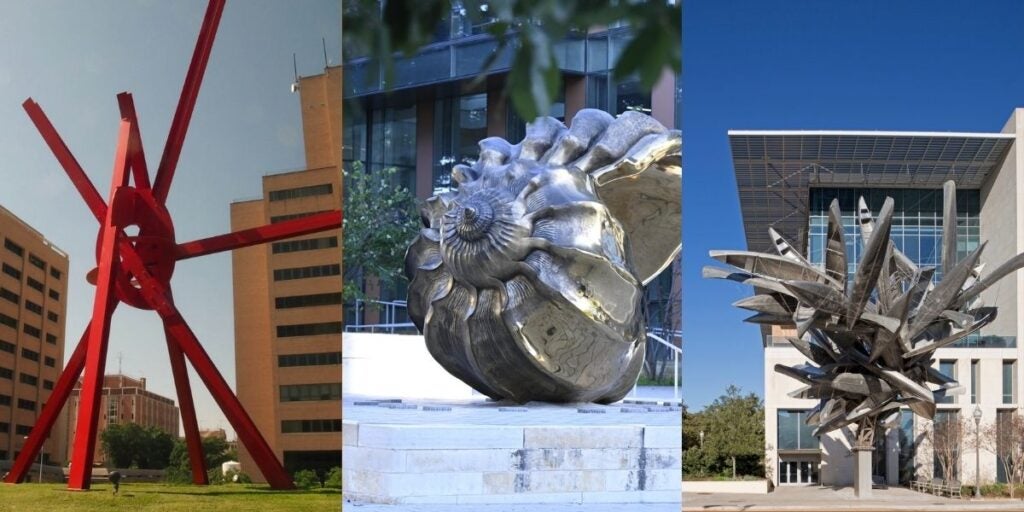Three diverse sculptures: a red starburst, a metallic ammonite, and an abstract silver piece in front of modern buildings.